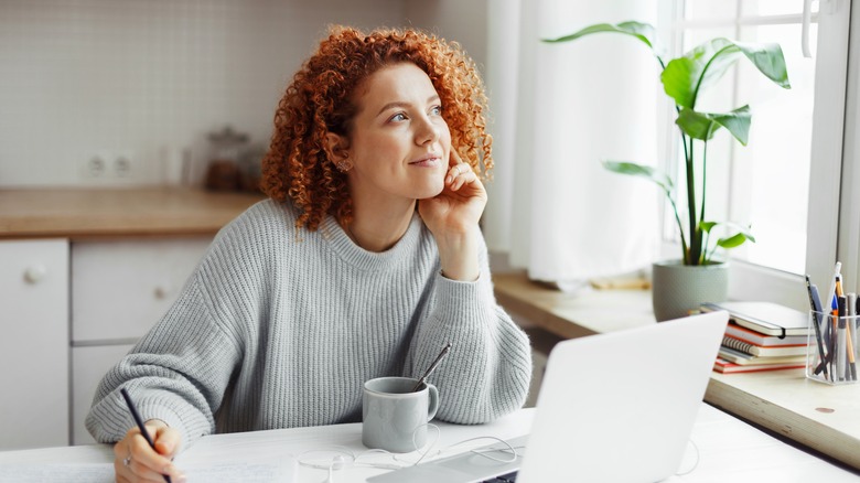 woman working by kitchen window