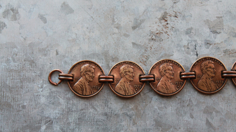 Penny bracelet on gray background