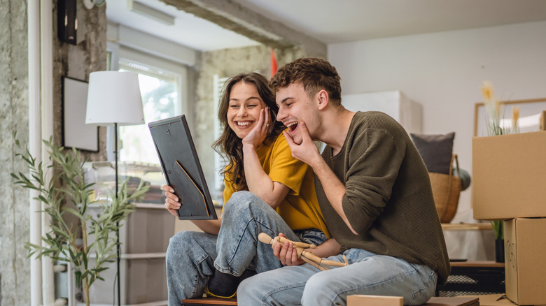Couple looking at a photo frame