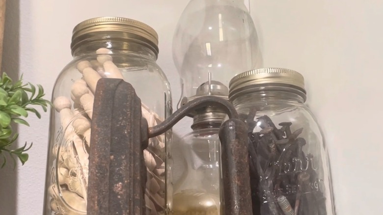 Nails in old glass jar