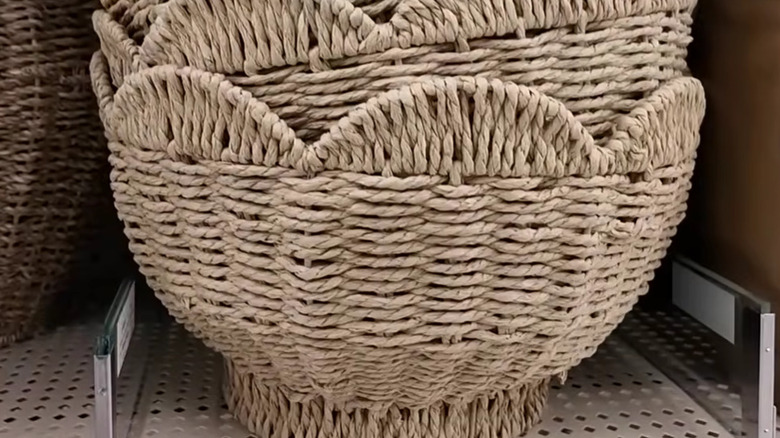 Scalloped woven bowl on a shelf at Hobby Lobby