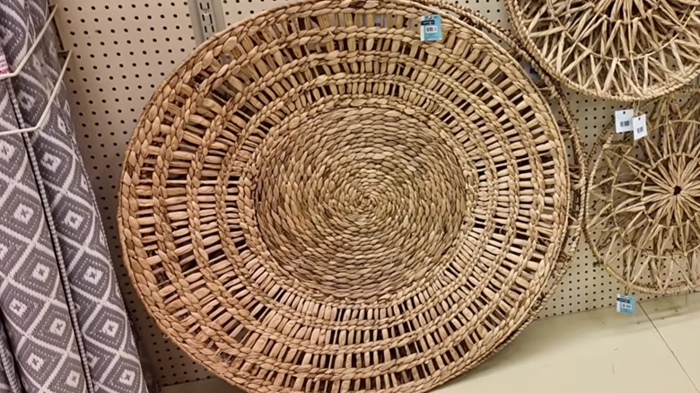 Water Hyacinth Basket Wall Decor on a shelf at Hobby Lobby