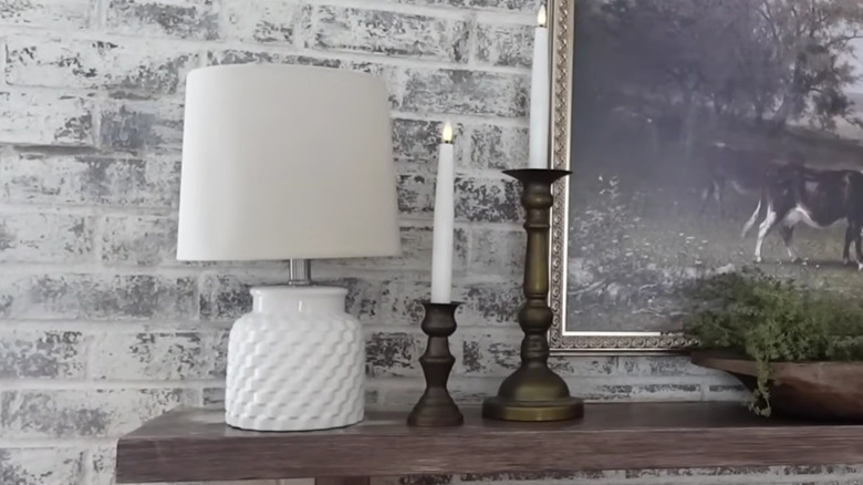Hobby Lobby white weave lamp styled on a mantel