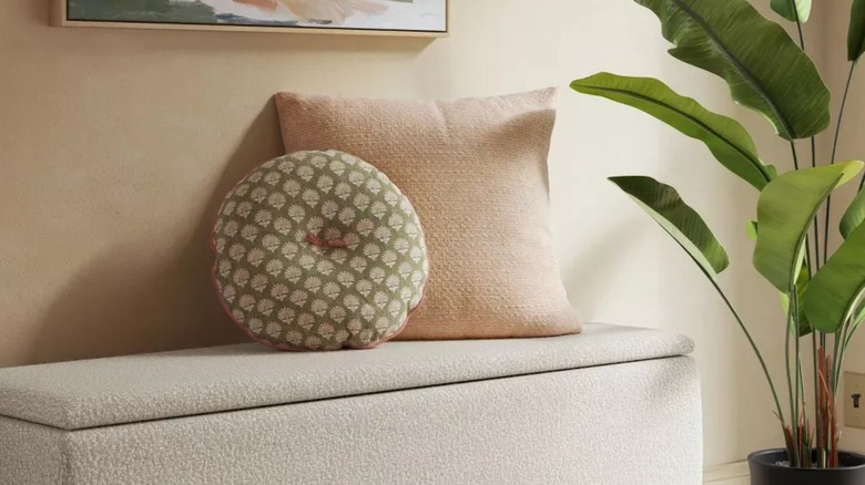 round pillow styled on a bench