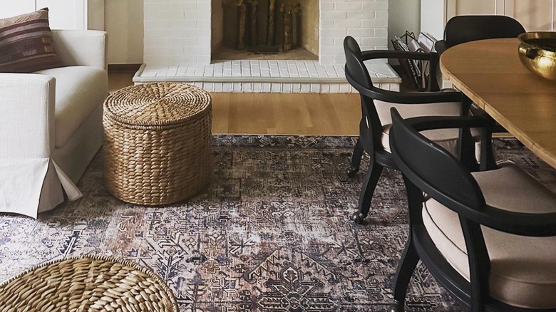 woven ottomans in front of white upholstered living room chairs