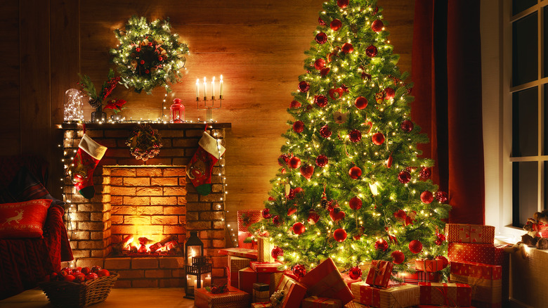 red ornaments on green tree