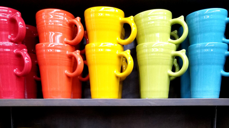 A row of primary color stacked mugs