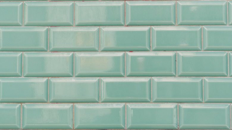 Mint green subway tiles with white grout