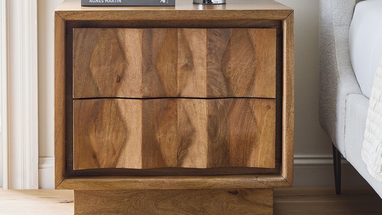 Closeup of a carved wood nightstand