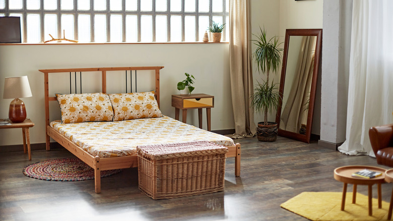 Bedroom with decor elements with different wood tones