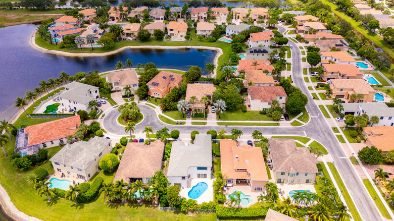 Aerial view of a neighborhood around a lake