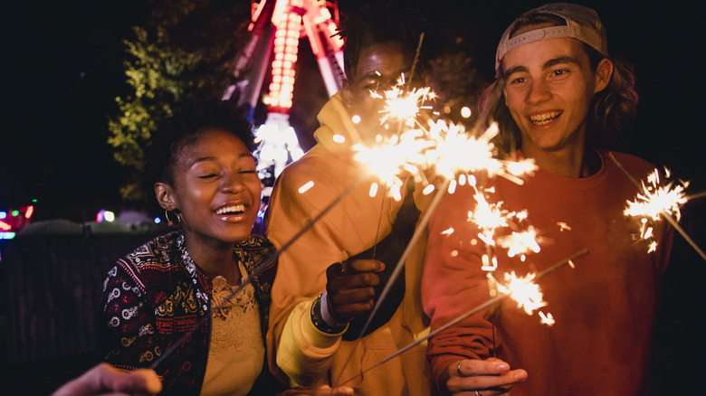 Young adults are having fun with sparkler