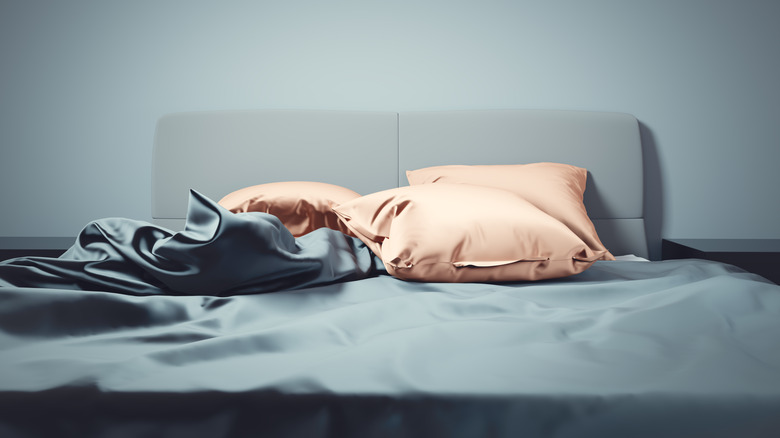 A gray and biege sateen bedding set