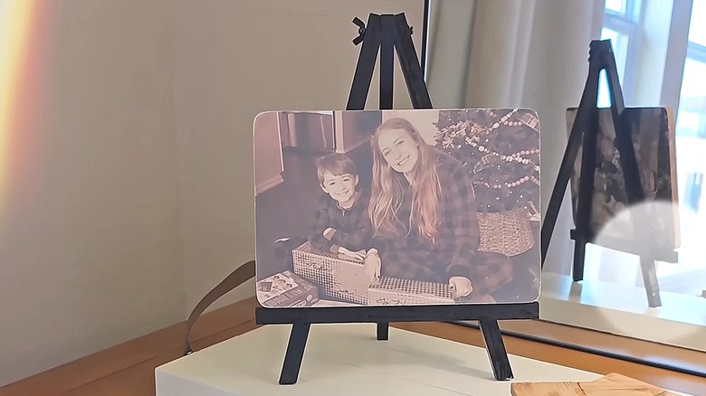 Printed photo attached to a wooden cutting board and displayed on a wood easel