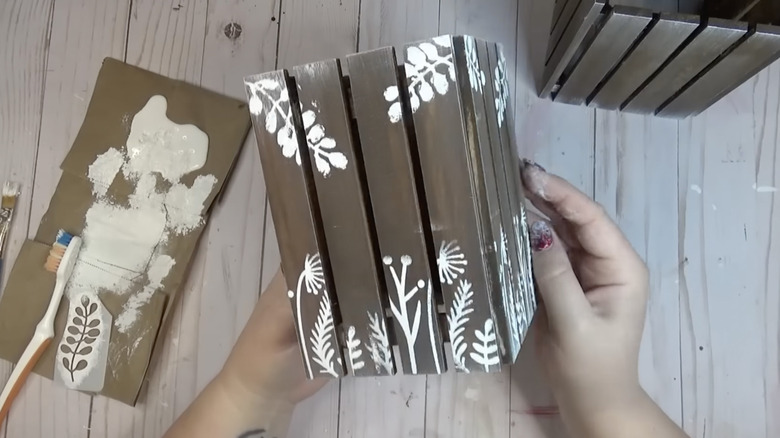 Solar light holder painted with botanicals on the side