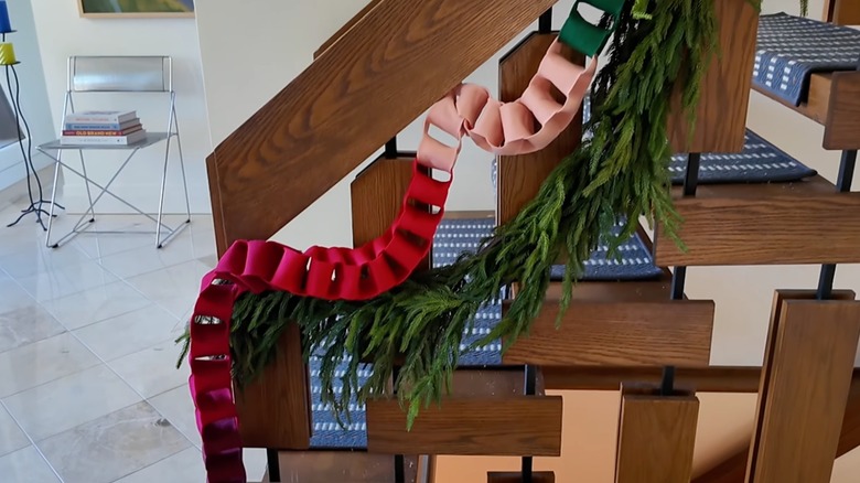 Felt fabric chain garland on stairway railing