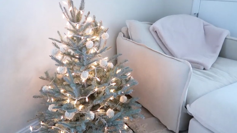 DIY pom-pom garland wrapped around Christmas tree