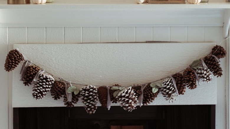 DIY pinecone garland on mantel