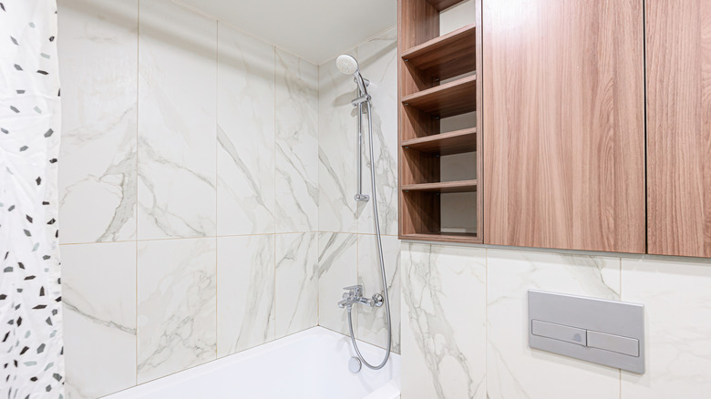 A contemporary bathroom with ample wall-mounted storage.