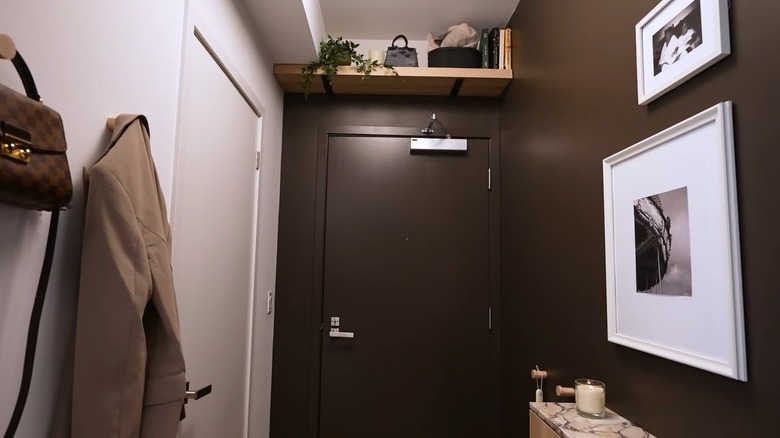 A shelf above an entryway door provides extra storage.