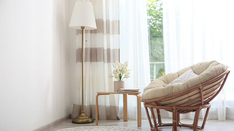 A papasan chair in a living room.