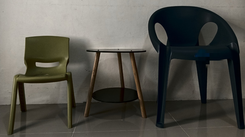 Twp plastic chairs flanking a table