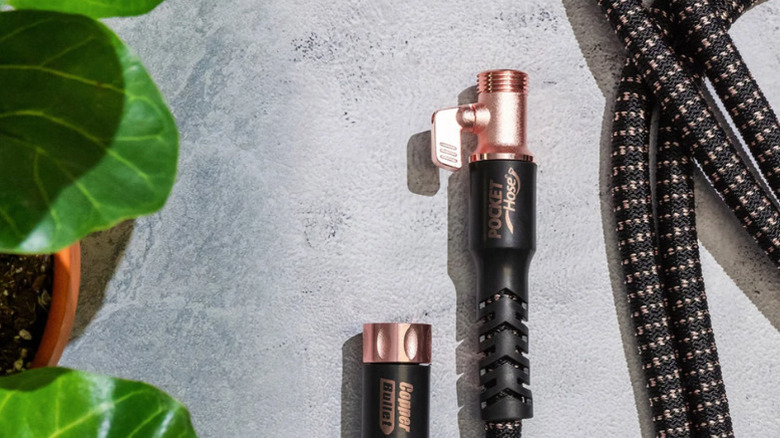 A close-up shot of the Copper Bullet Pocket Hose from Telebrands