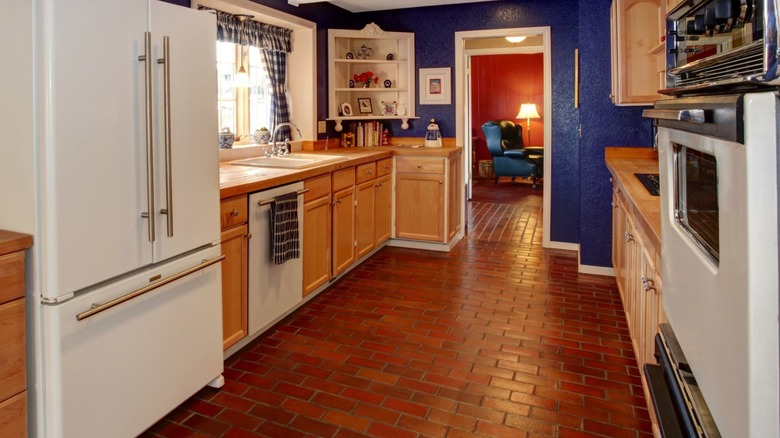 Kitchen with brick tile floor