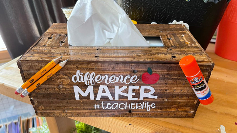 A DIY facial tissue box cover using vintage wooden rulers