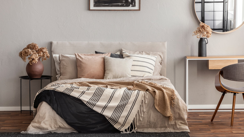 gray bedroom wall with bed