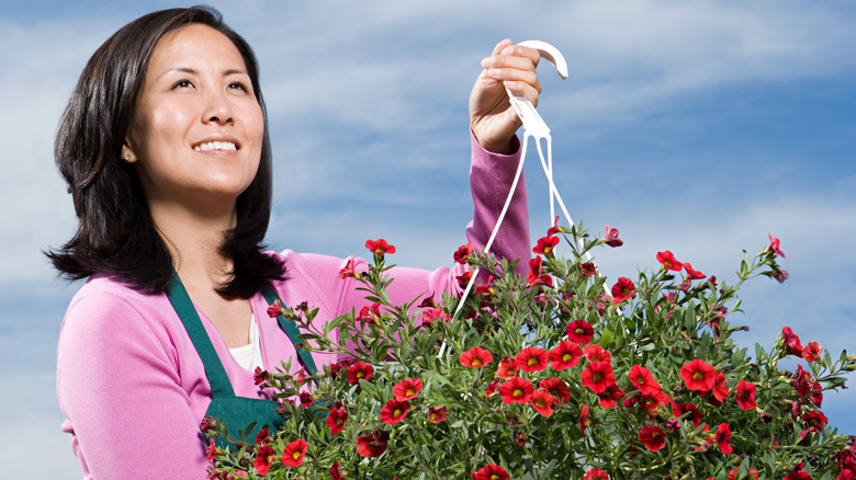 woman holding basket of flowers