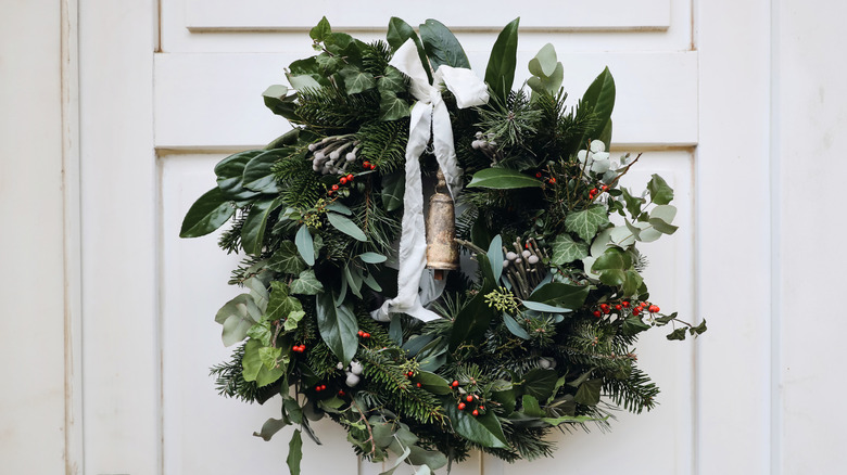 A festive wreath made from fresh foliage including English ivy