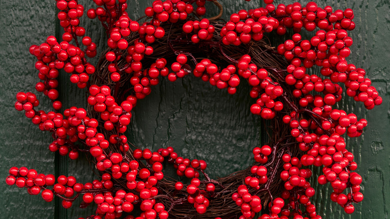 Winterberry branches shaped into a wreath form