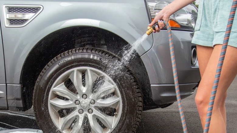 person using HydroTech Expandable Burst-proof Garden Hose to wash car