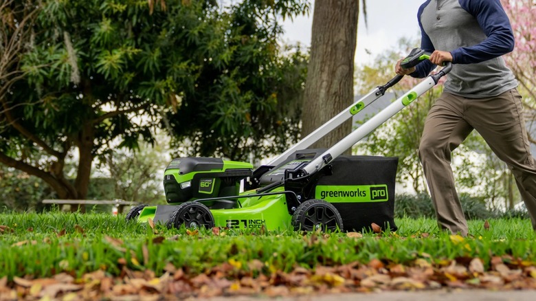 Person mushing Greenworks 60V Cordless Lawn Mower