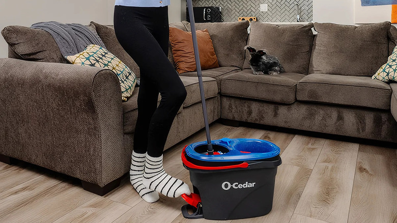 a person using the O-Cedar EasyWring Microfiber Spin Mop