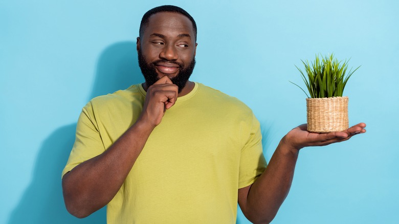 Man holding plant