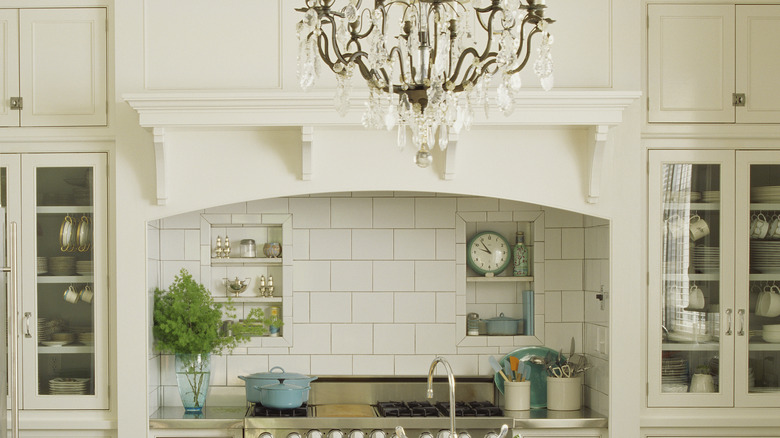 White kitchen with blue and green accessories