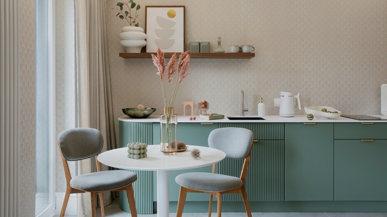 Light blue kitchen chairs by a small table