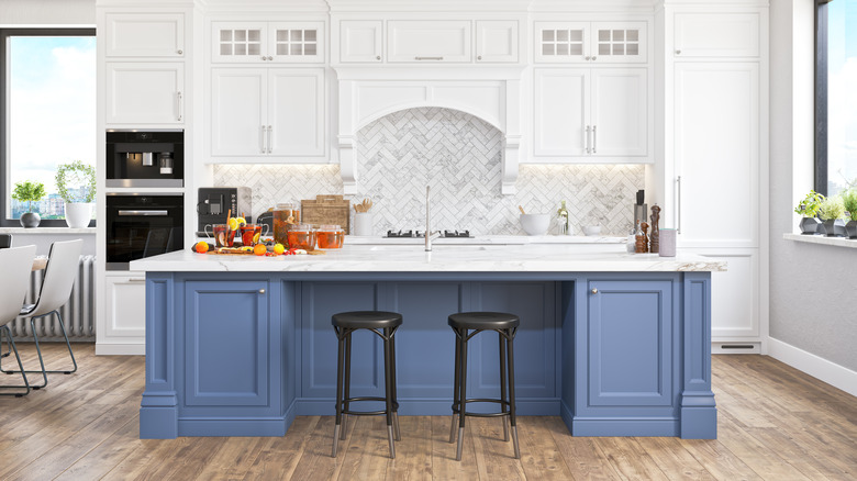 Closeup of dark blue island with gold hardware