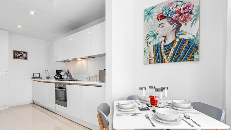 Kitchen with blue and green wall art