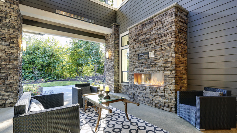 back porch with stone fireplace