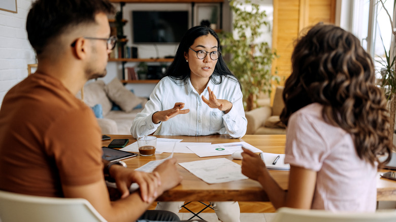 couple talking to loan officer