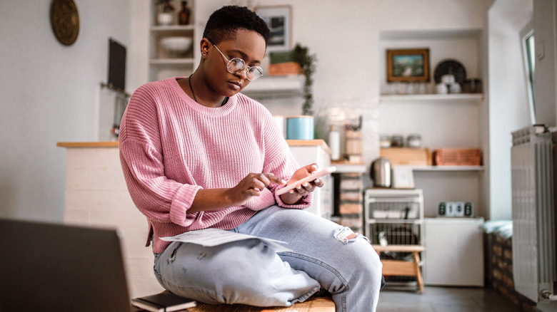 woman calculating savings