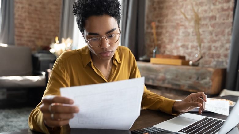 woman reading over a document