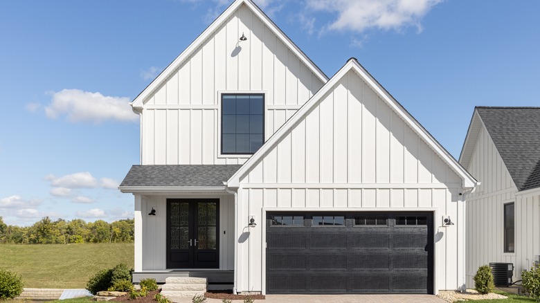 white farmhouse with black door