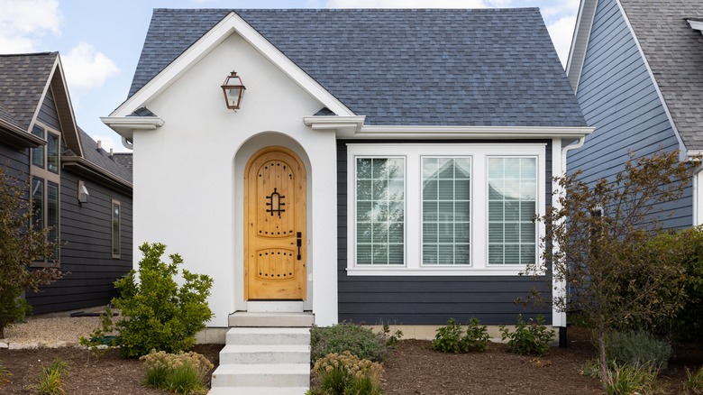 Farmhouse wooden front-door with steel