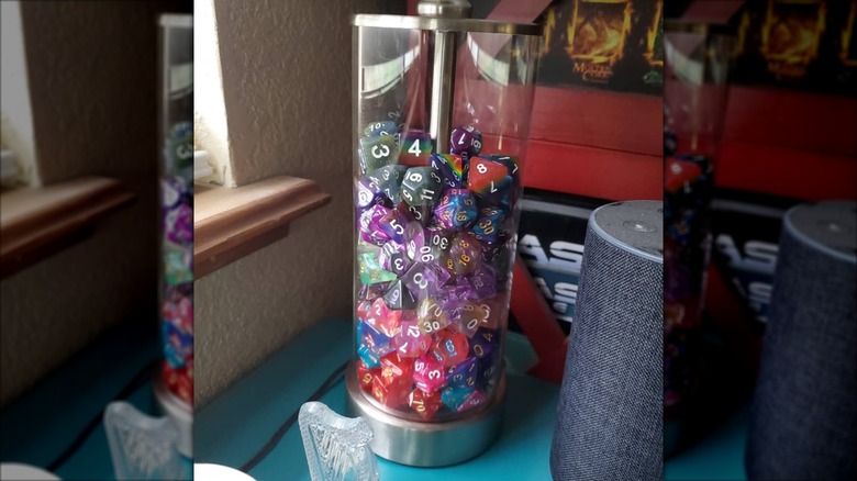 Colorful dice inside of a clear lamp base