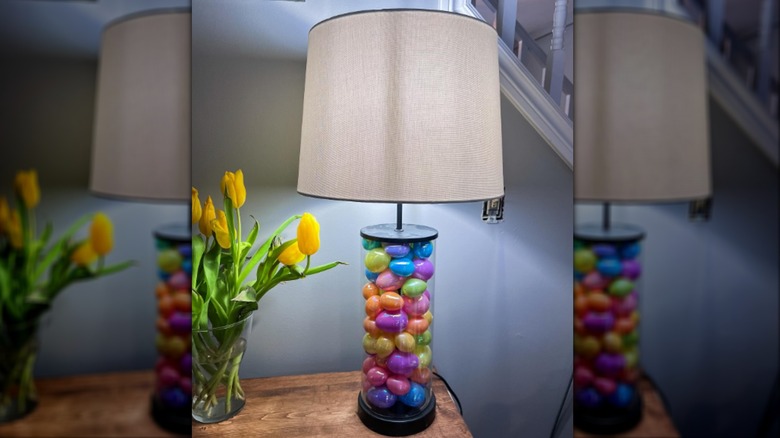 Plastic eggs in a clear lamp on a table