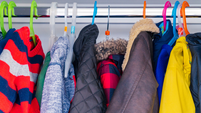 Children's coats hanging in a closet